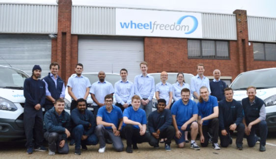 Wheelfreedom Team outside the new building